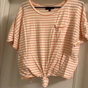 A striped peach and white shirt.